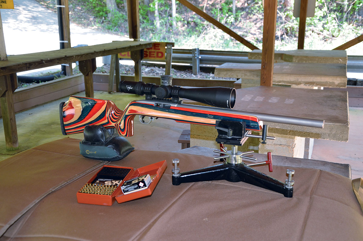 The Fraley-built 10/22 is shown here resting on a sandbag at the rear and a Sinclair adjustable rest up front.